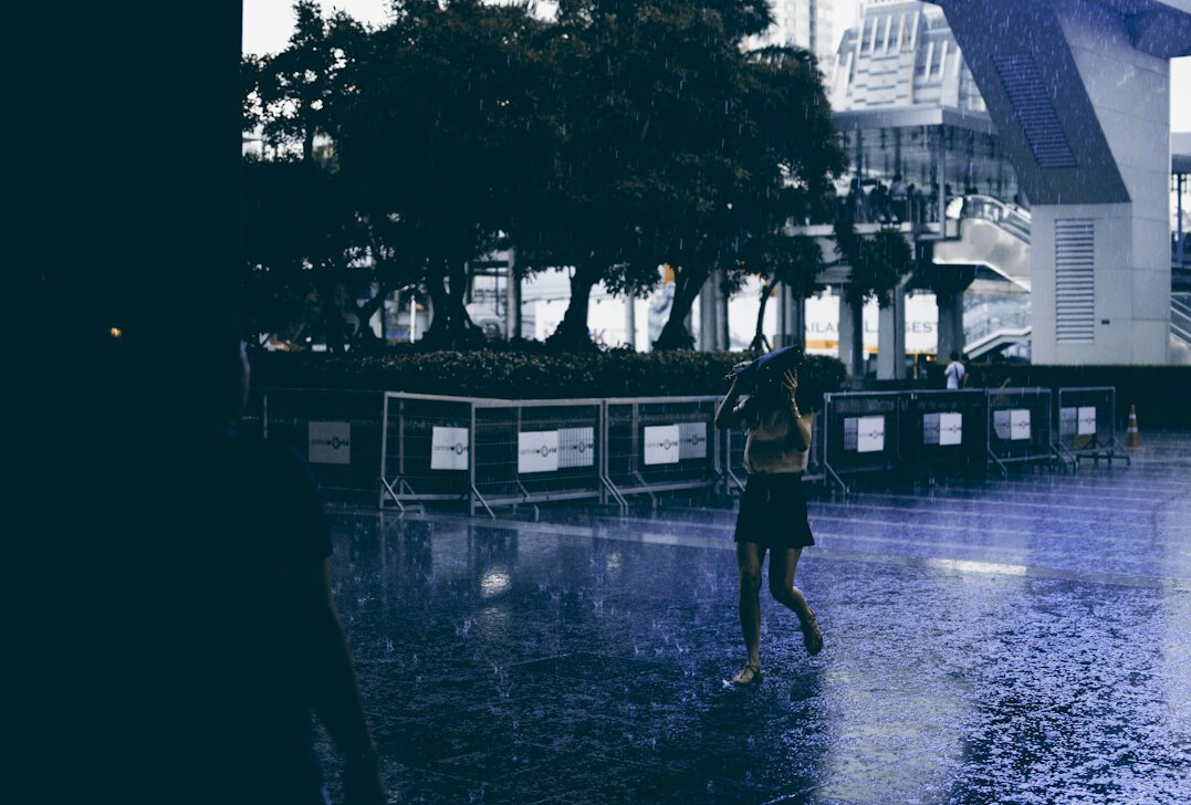 detective walking in rain